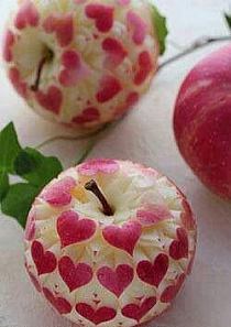 Apple With Carved Hearts Made with a Fruit Knife